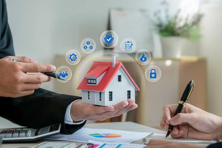Tenant reviews an insurance policy beside a laptop, receipts, and a home inventory checklist.